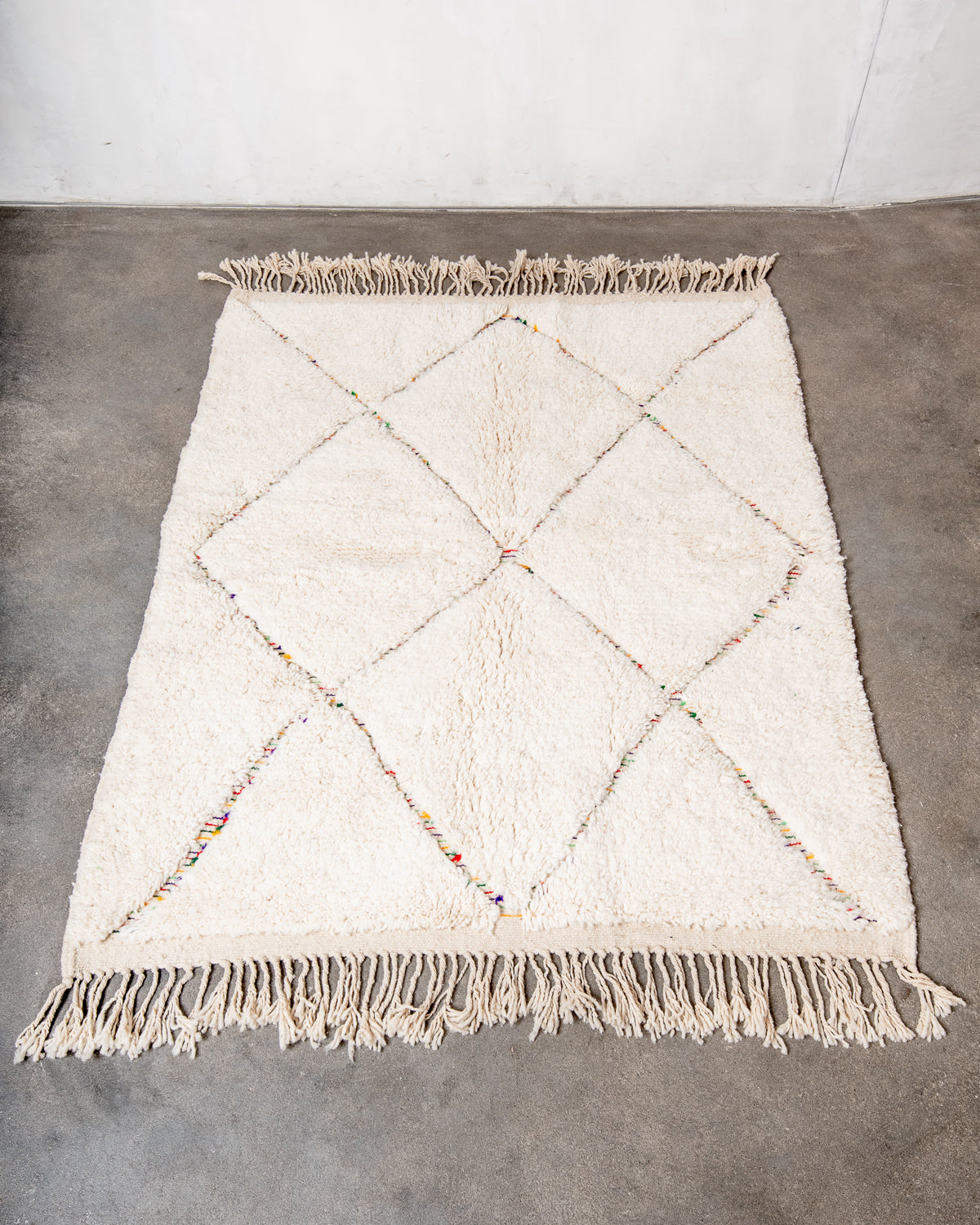 Modern, designer, handcrafted Berber rug from Morocco. Beniourain carpet with beautiful colours and patterns and fluffy wool texture.